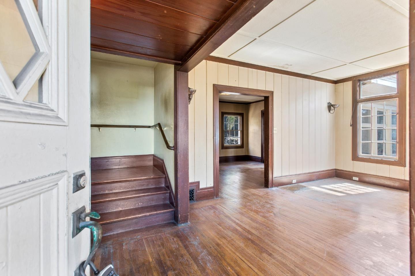 585 Santa Rosa Avenue Berkeley, CA 94707 - Photo 12 of 71 a view of entryway with wooden floor and stairs