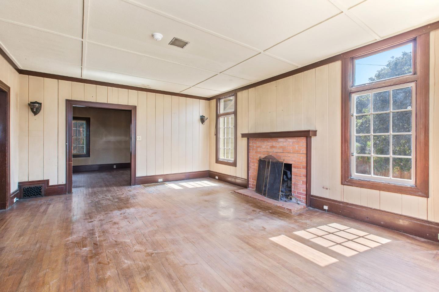 585 Santa Rosa Avenue Berkeley, CA 94707 - Photo 14 of 71 a view of a livingroom with a fireplace and window