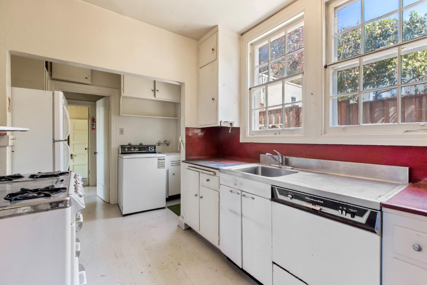 585 Santa Rosa Avenue Berkeley, CA 94707 - Photo 23 of 71 a kitchen with stainless steel appliances granite countertop a stove and a refrigerator