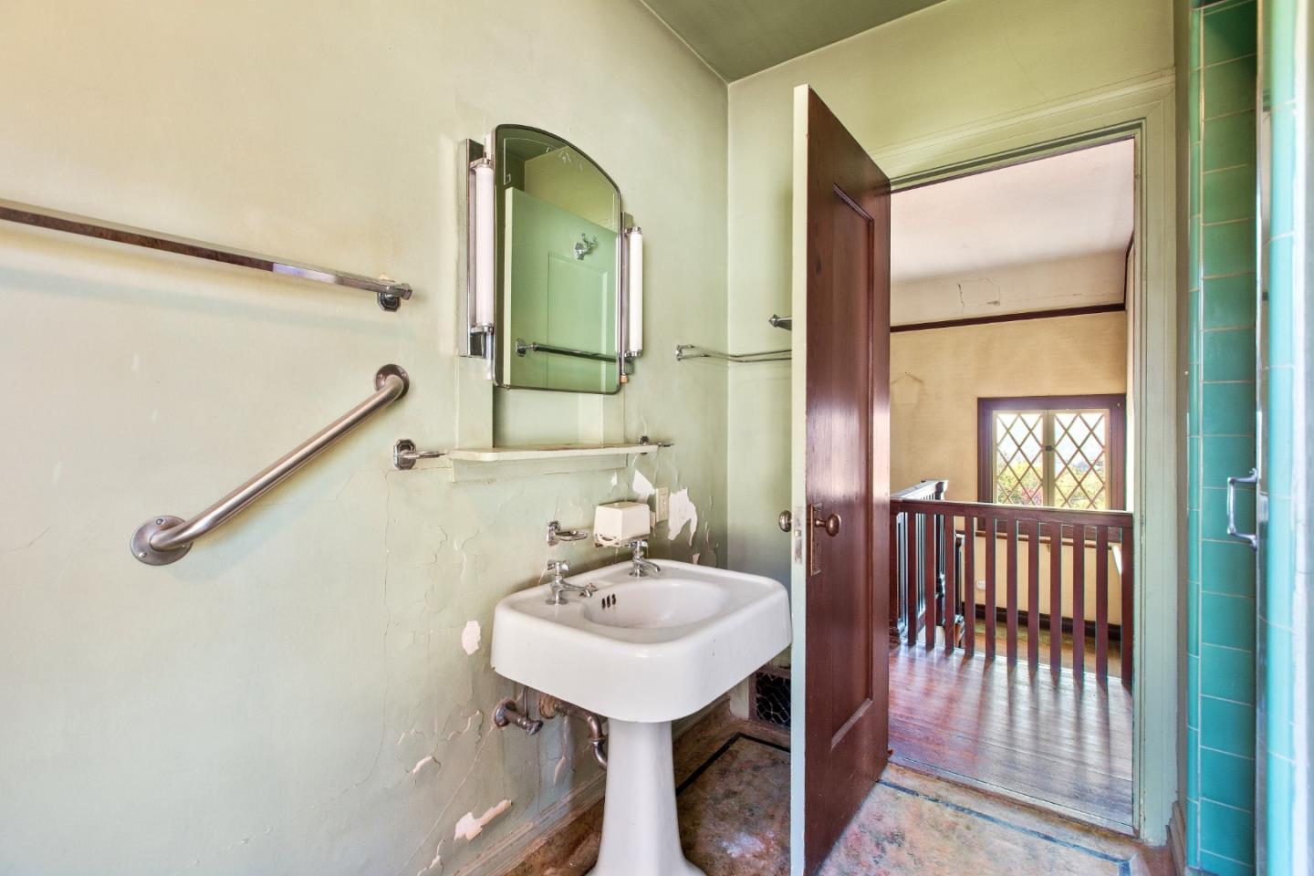 585 Santa Rosa Avenue Berkeley, CA 94707 - Photo 37 of 71 a bathroom with a sink a mirror and a shower