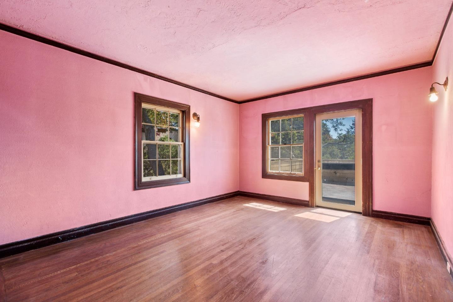 585 Santa Rosa Avenue Berkeley, CA 94707 - Photo 39 of 71 a view of an empty room with window and wooden floor