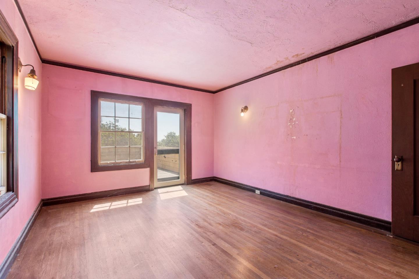 585 Santa Rosa Avenue Berkeley, CA 94707 - Photo 40 of 71 a view of an empty room with window and wooden floor