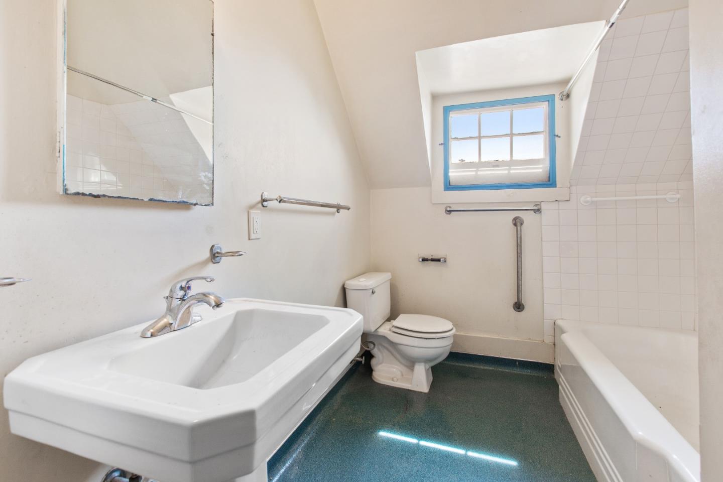 585 Santa Rosa Avenue Berkeley, CA 94707 - Photo 49 of 71 a white toilet sitting next to a bathroom sink