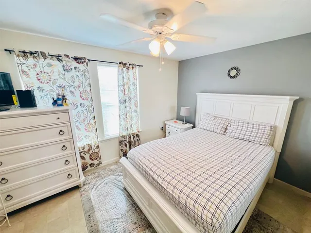 a bedroom with a bed and a walk in closet