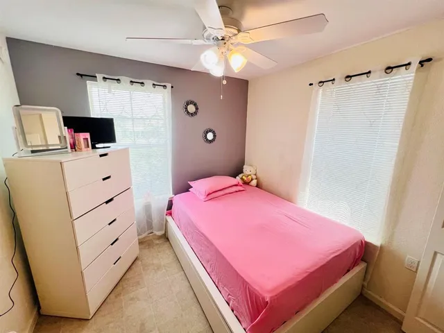 a bedroom with a bed and a shower