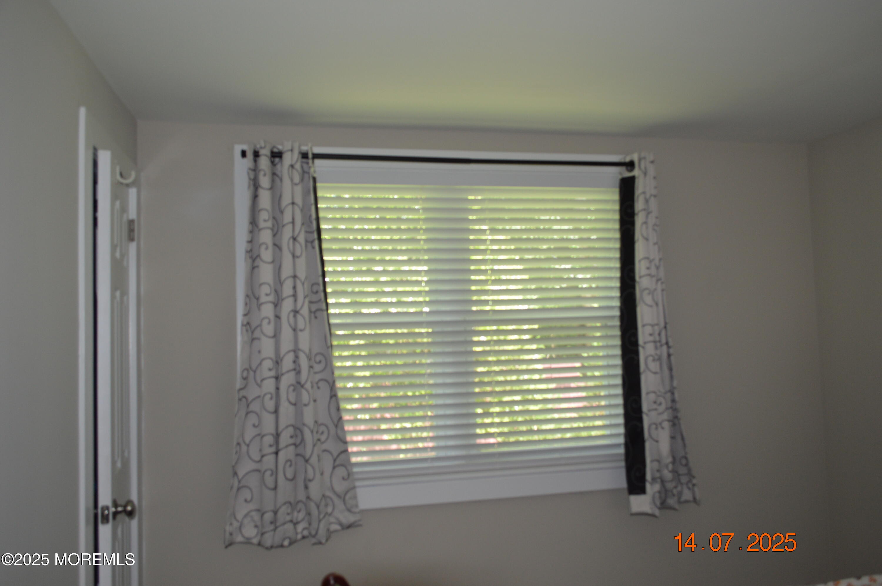 Undisclosed Address Roosevelt, NJ 08555 - Photo 3 of 20 a view of an empty room with a window