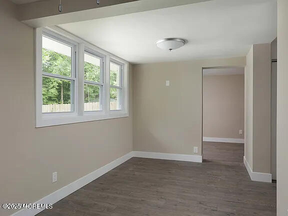 Undisclosed Address Roosevelt, NJ 08555 - Photo 8 of 20 an empty room with wooden floor and windows
