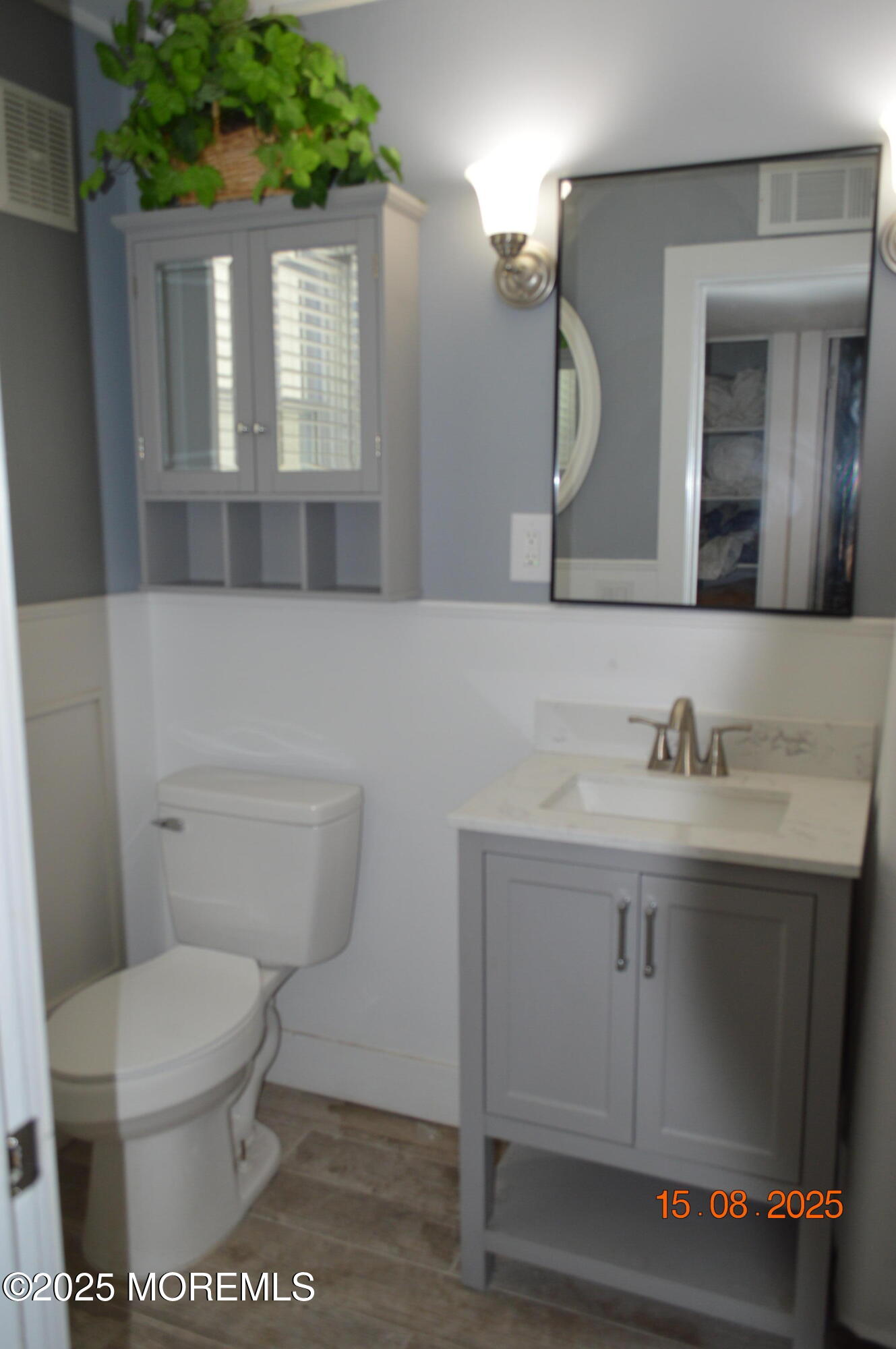 Undisclosed Address Roosevelt, NJ 08555 - Photo 9 of 20 a bathroom with a granite countertop sink a toilet and a mirror