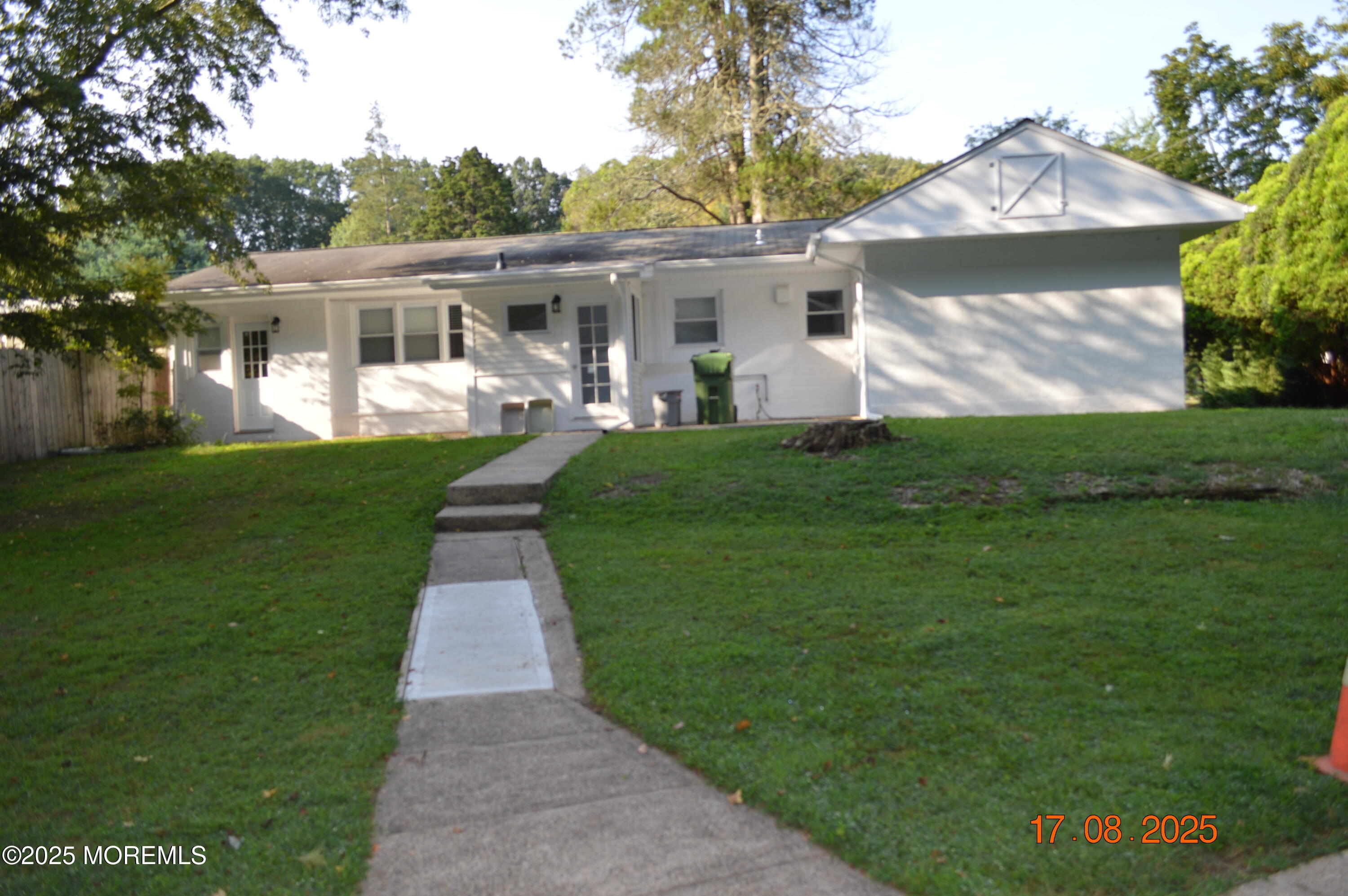 Undisclosed Address Roosevelt, NJ 08555 - Photo 10 of 20 a front view of a house with a garden