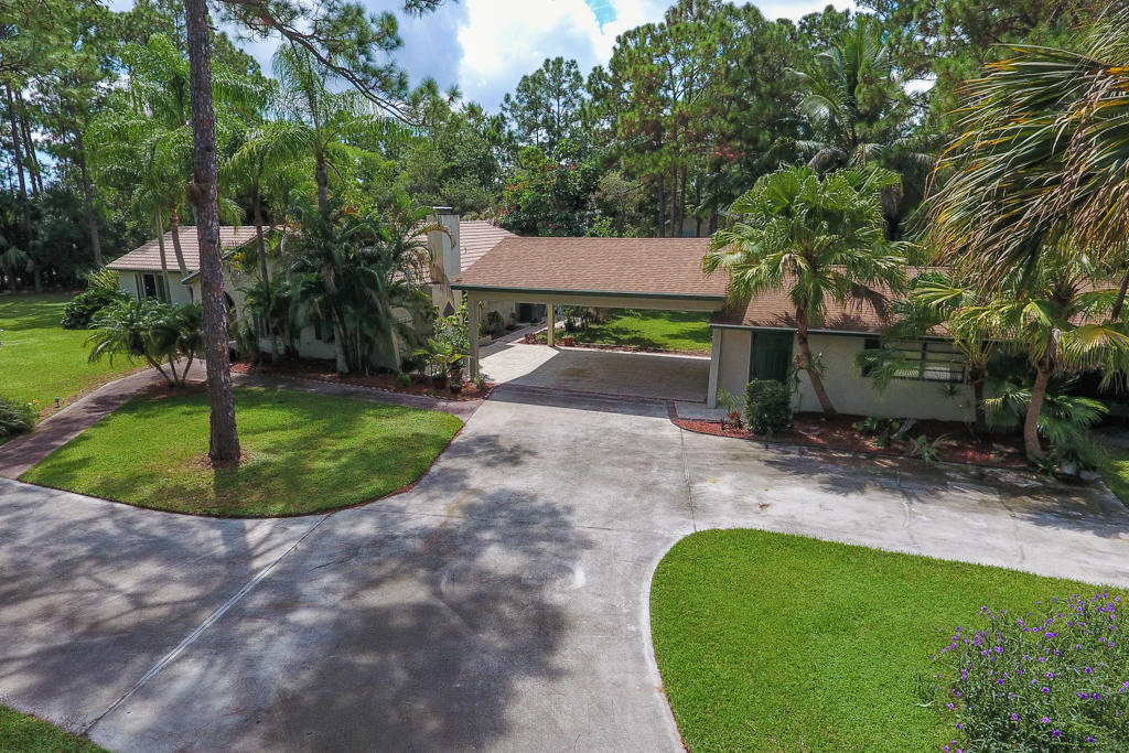 15429 Jupiter Farms Road Jupiter, FL 33478 - Photo 51 of 59 a view of a backyard with a garden