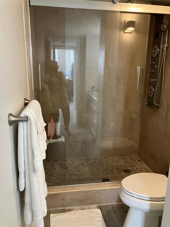 4001 Hillcrest Drive, Unit 1012 Hollywood, FL 33021 - Photo 8 of 14 a bathroom with a shower and toilet