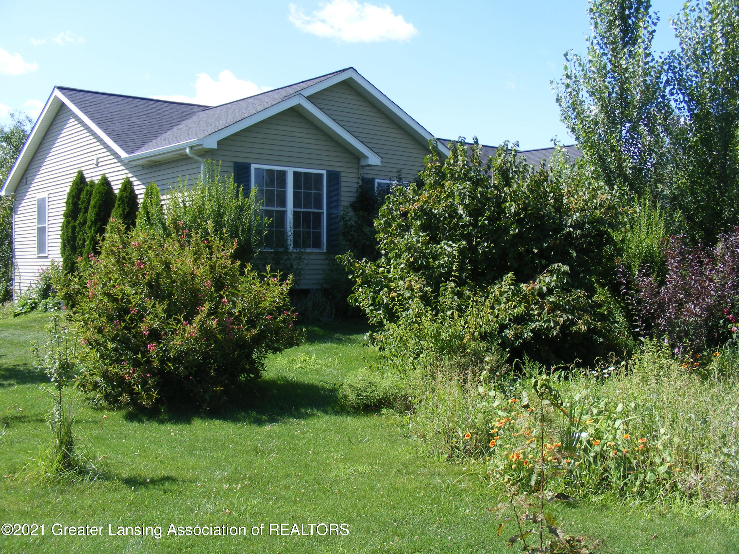 2430 South Meridian Road Ovid, MI 48866 - Photo 2 of 36 front side