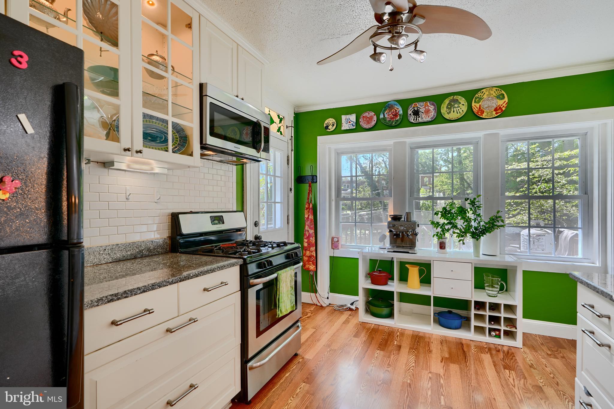 1111 Overbrook Road Baltimore, MD 21239 - Photo 12 of 47 a kitchen with stainless steel appliances granite countertop a stove and cabinets
