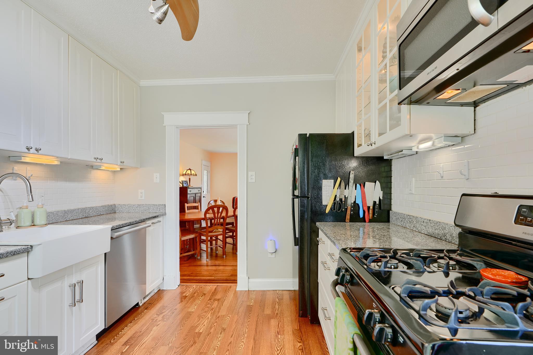 1111 Overbrook Road Baltimore, MD 21239 - Photo 13 of 47 a kitchen with stainless steel appliances granite countertop a stove and a sink