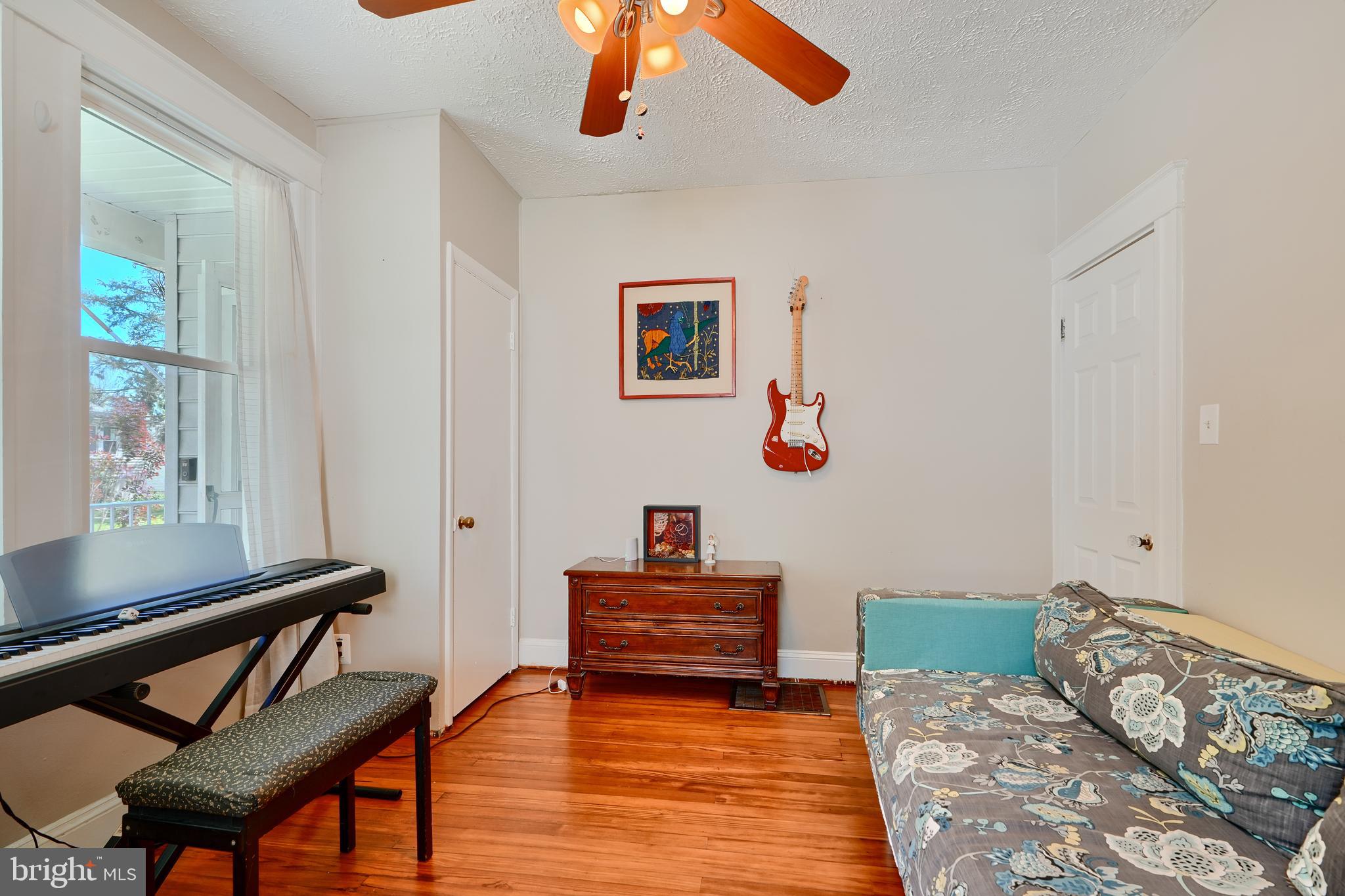 1111 Overbrook Road Baltimore, MD 21239 - Photo 17 of 47 a living room with furniture and a wooden floor