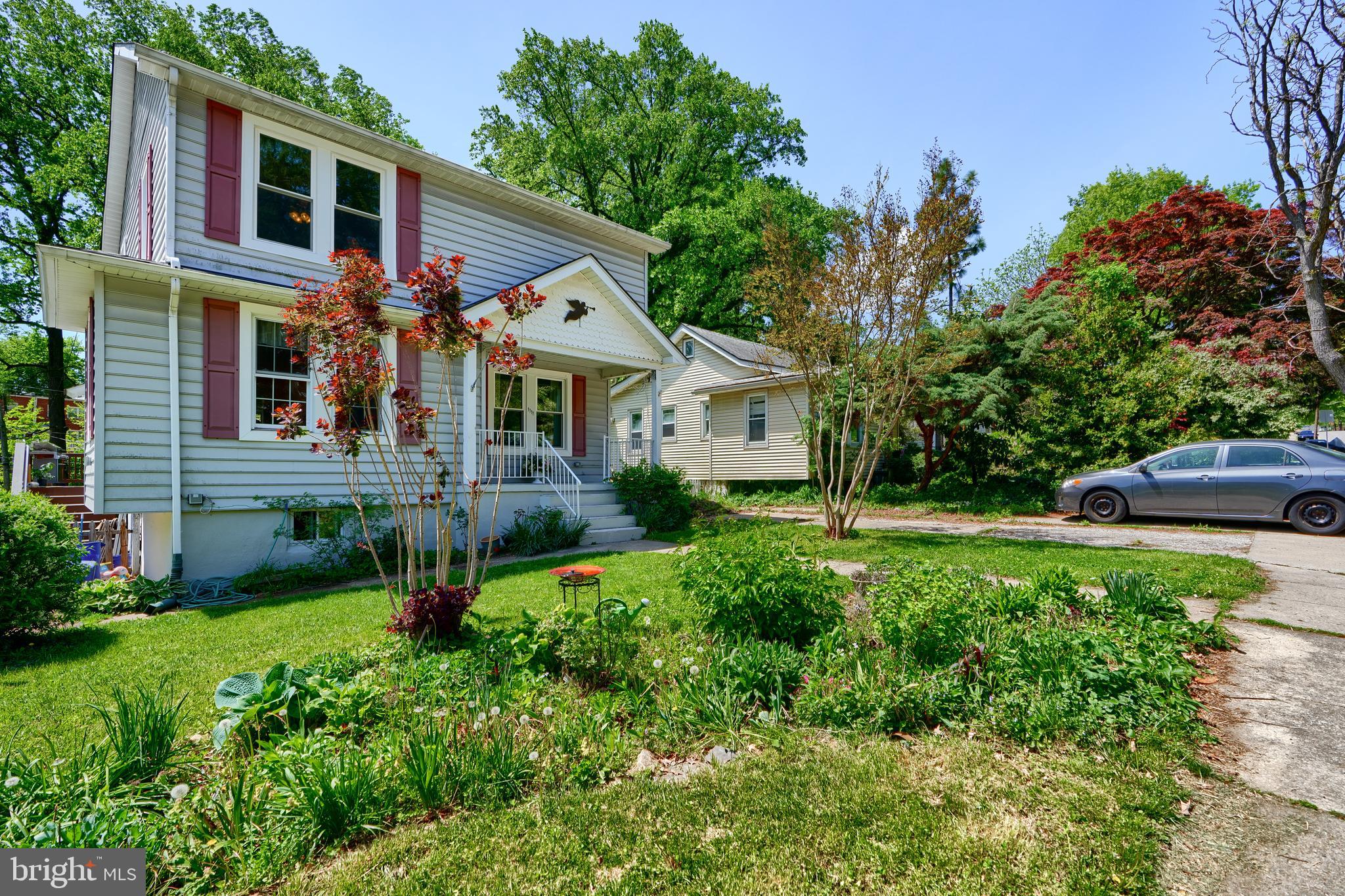 1111 Overbrook Road Baltimore, MD 21239 - Photo 2 of 47 a front view of a house with a yard