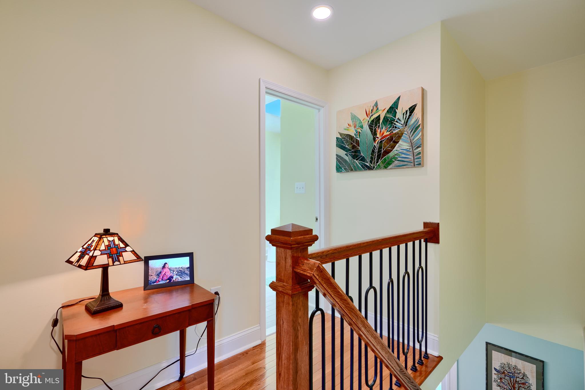 1111 Overbrook Road Baltimore, MD 21239 - Photo 24 of 47 a view of a hallway with paintings on the wall