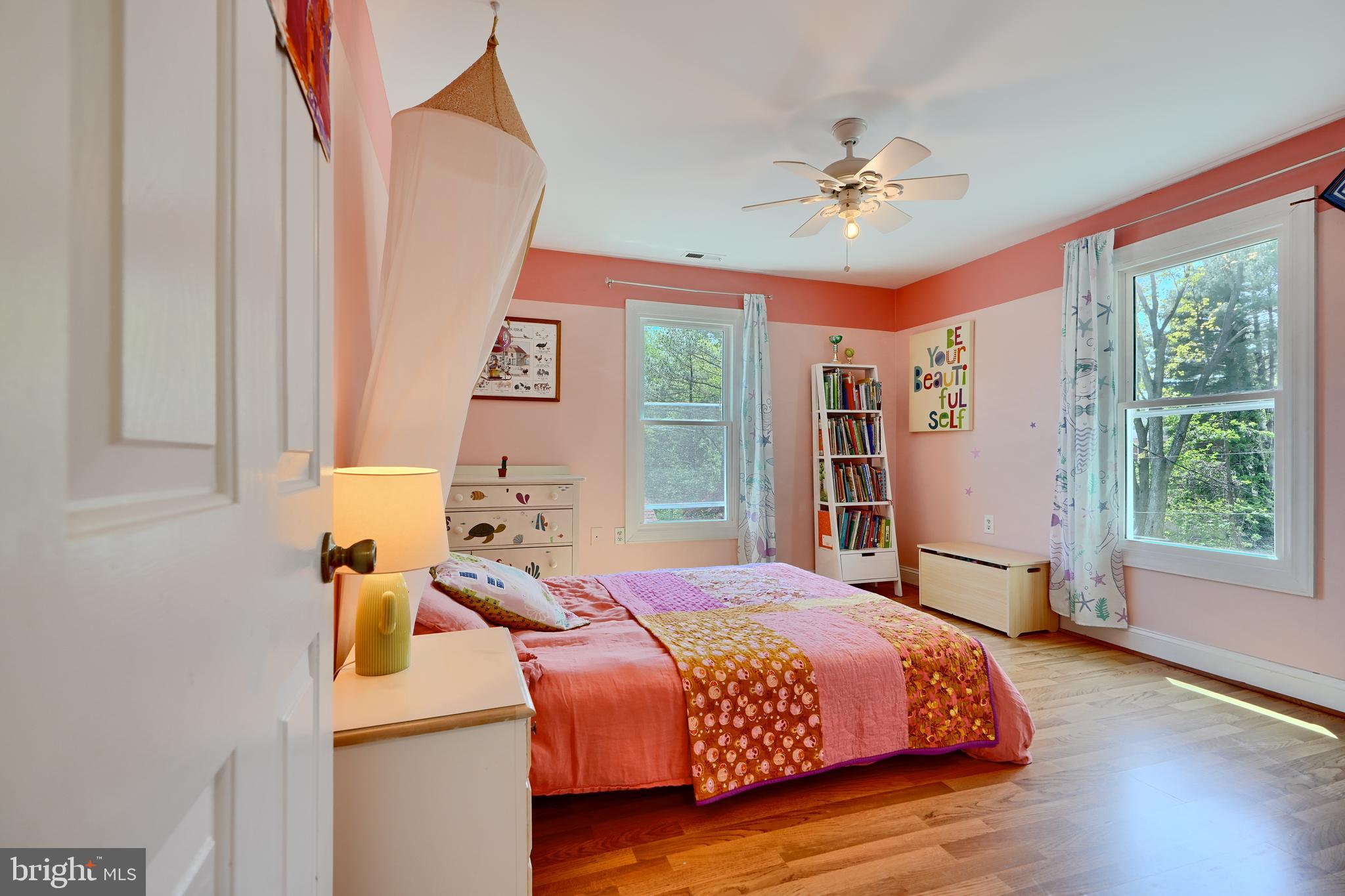 1111 Overbrook Road Baltimore, MD 21239 - Photo 25 of 47 a bedroom with a bed and a chandelier