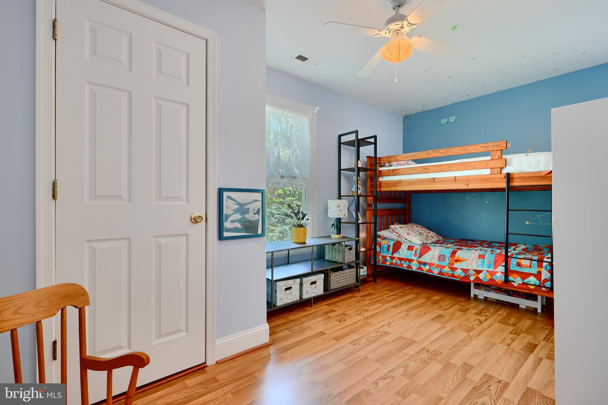 1111 Overbrook Road Baltimore, MD 21239 - Photo 33 of 47 a bedroom with furniture and a wooden floor