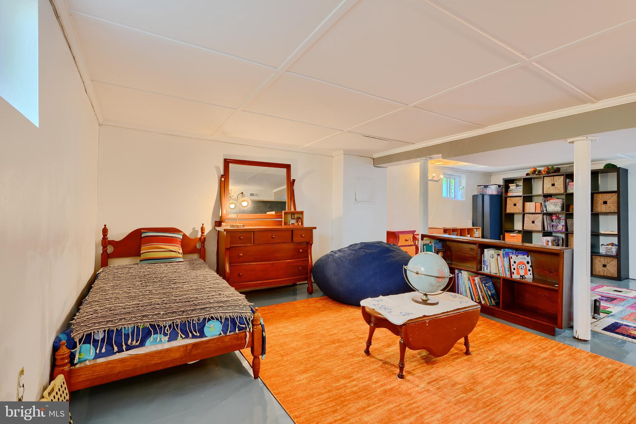 1111 Overbrook Road Baltimore, MD 21239 - Photo 38 of 47 a bedroom with furniture and a book shelf