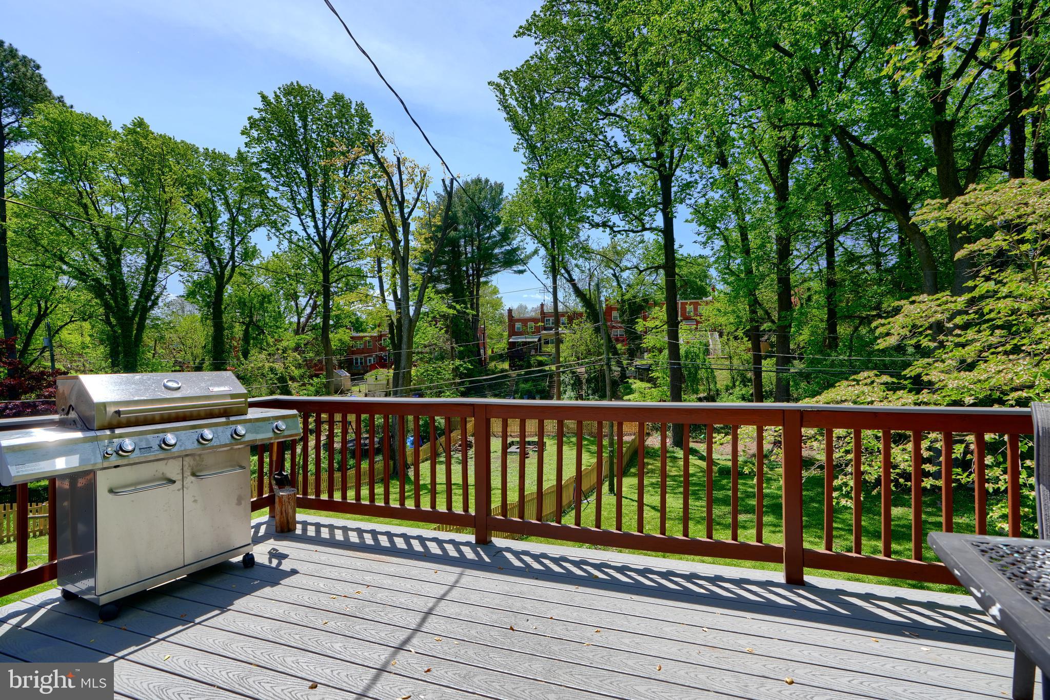 1111 Overbrook Road Baltimore, MD 21239 - Photo 41 of 47 a view of a wooden deck with a yard