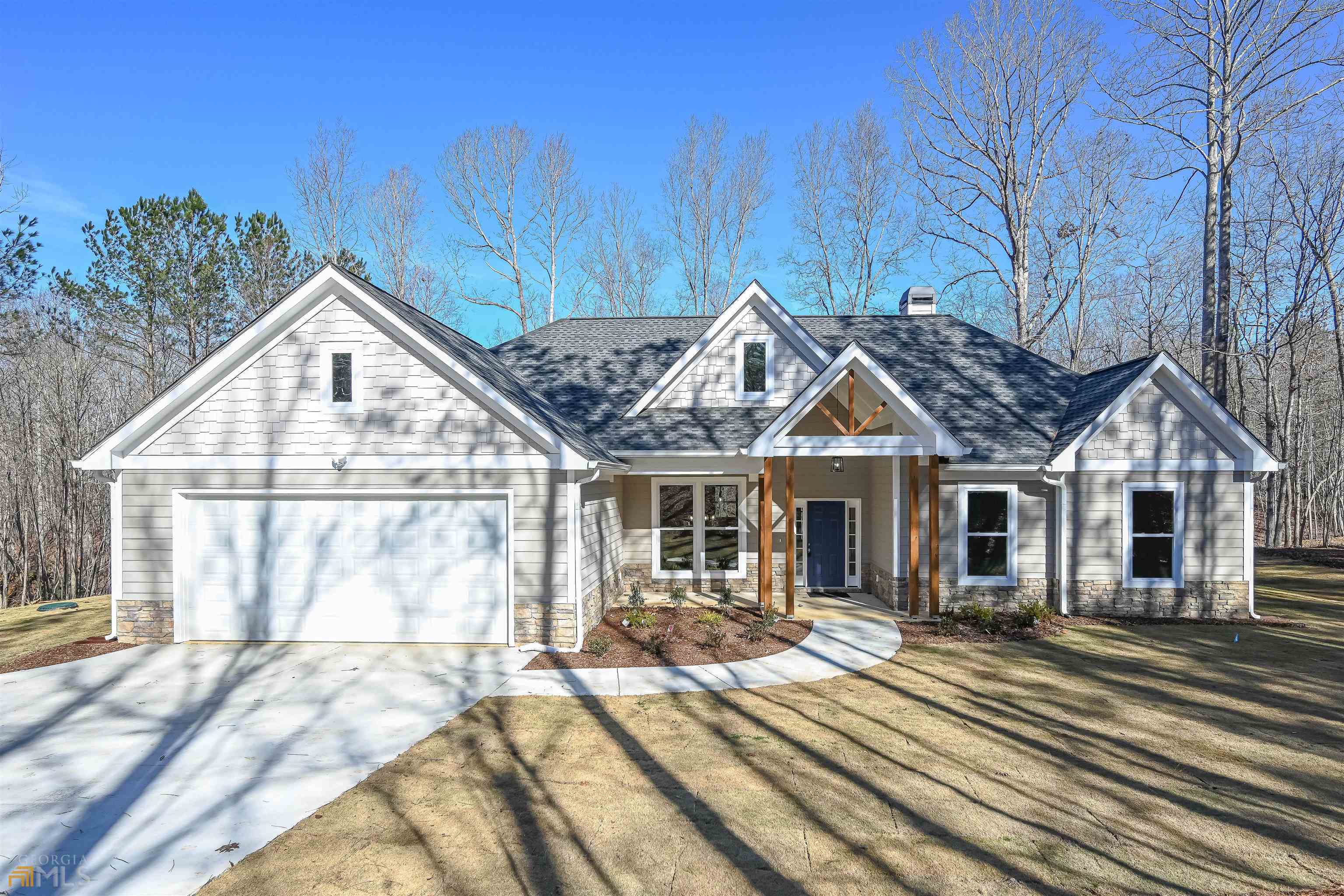 86 Joe Rowell Road Buchanan, GA 30153 - Photo 1 of 1 a view of a house next to a yard