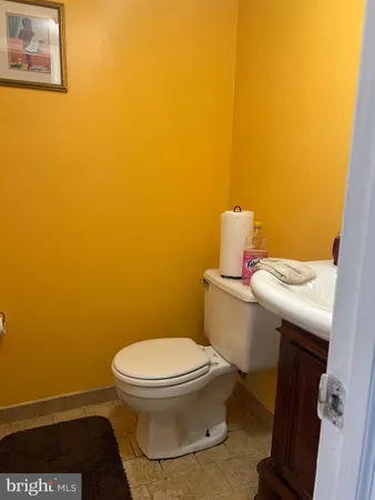 a bathroom with a toilet and a sink