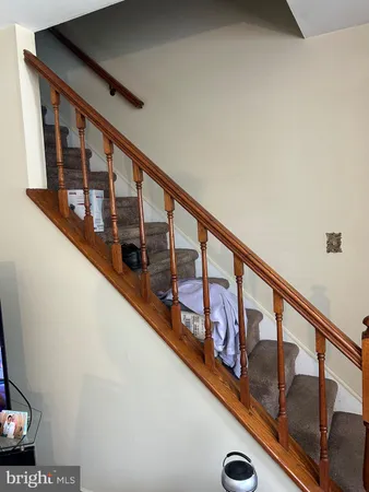 a view of staircase with lots of wooden floor