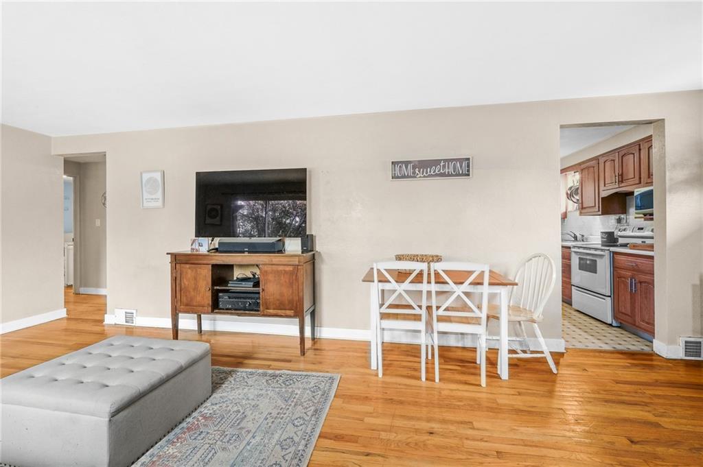 1654 Hollyrood Road Pittsburgh, PA 15227 - Photo 8 of 33 a living room with furniture and a wooden floor