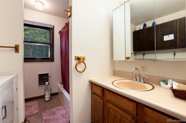 a en suite bathroom with a sink and a mirror