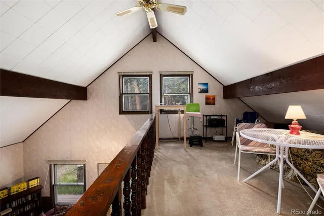 a room with furniture and stairs