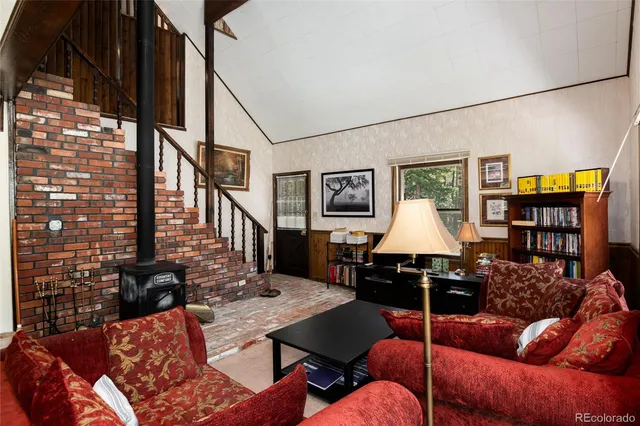 a living room with furniture and a table