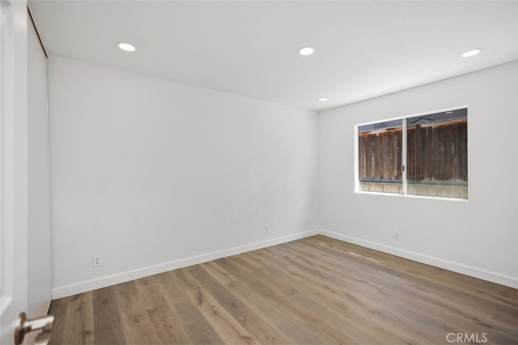 28222 Via Alfonse Laguna Niguel, CA 92677 - Photo 8 of 10 a view of an empty room with wooden floor and a window