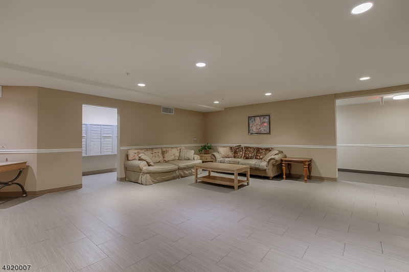 2889 Highway 10, Unit 1310 Morris Plains, NJ 07950 - Photo 11 of 16 a living room with furniture and a couch