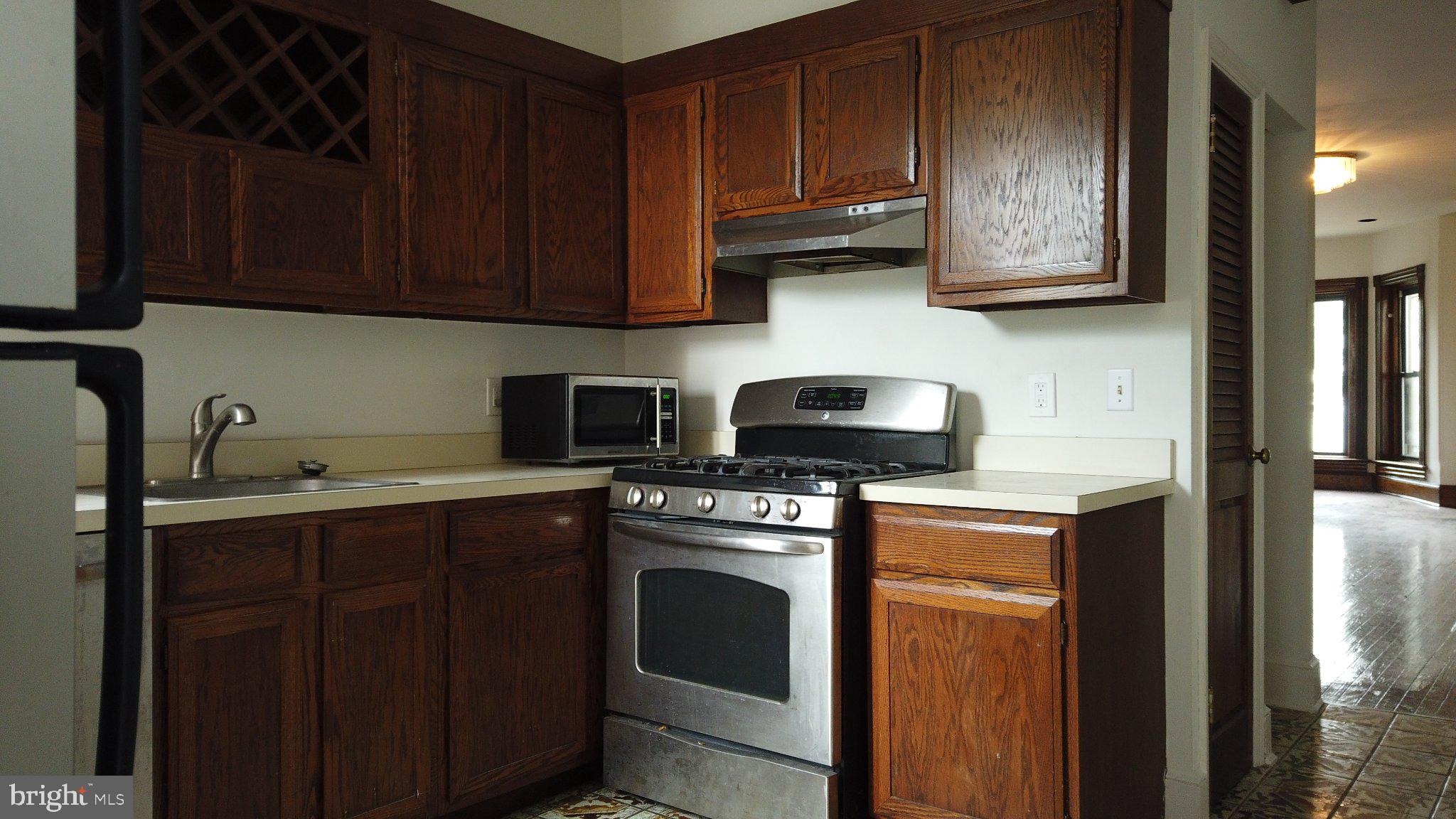 604 9th Street Northeast Washington, DC 20002 - Photo 24 of 28 Cozy kitchen with rich wood accents.