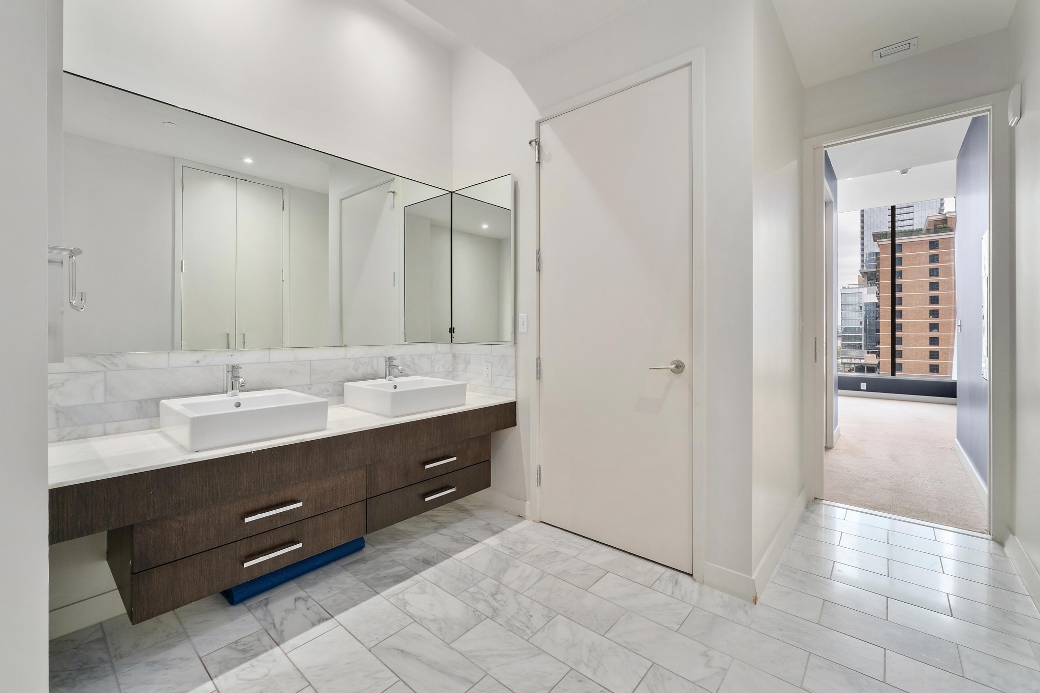 210 Lavaca Street, Unit 1810 Austin, TX 78701 - Photo 14 of 28 Full bathroom with double vanity and tasteful backsplash