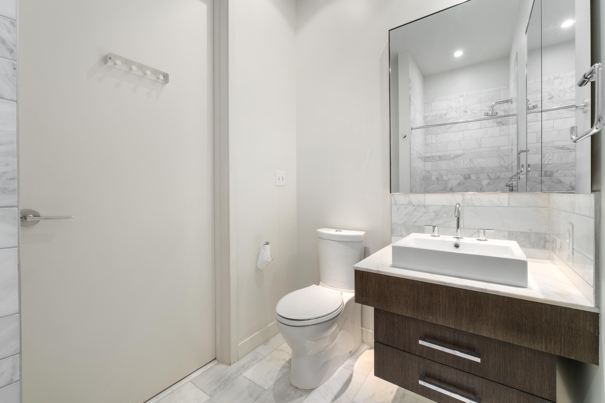 210 Lavaca Street, Unit 1810 Austin, TX 78701 - Photo 20 of 28 Full bathroom featuring vanity and a shower stall