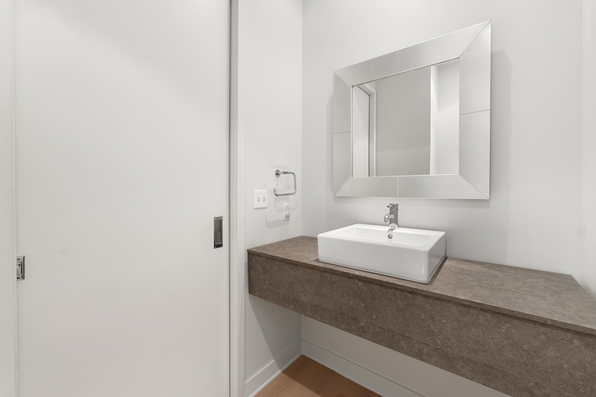 210 Lavaca Street, Unit 1810 Austin, TX 78701 - Photo 22 of 28 Bathroom with vanity and wood finished floors