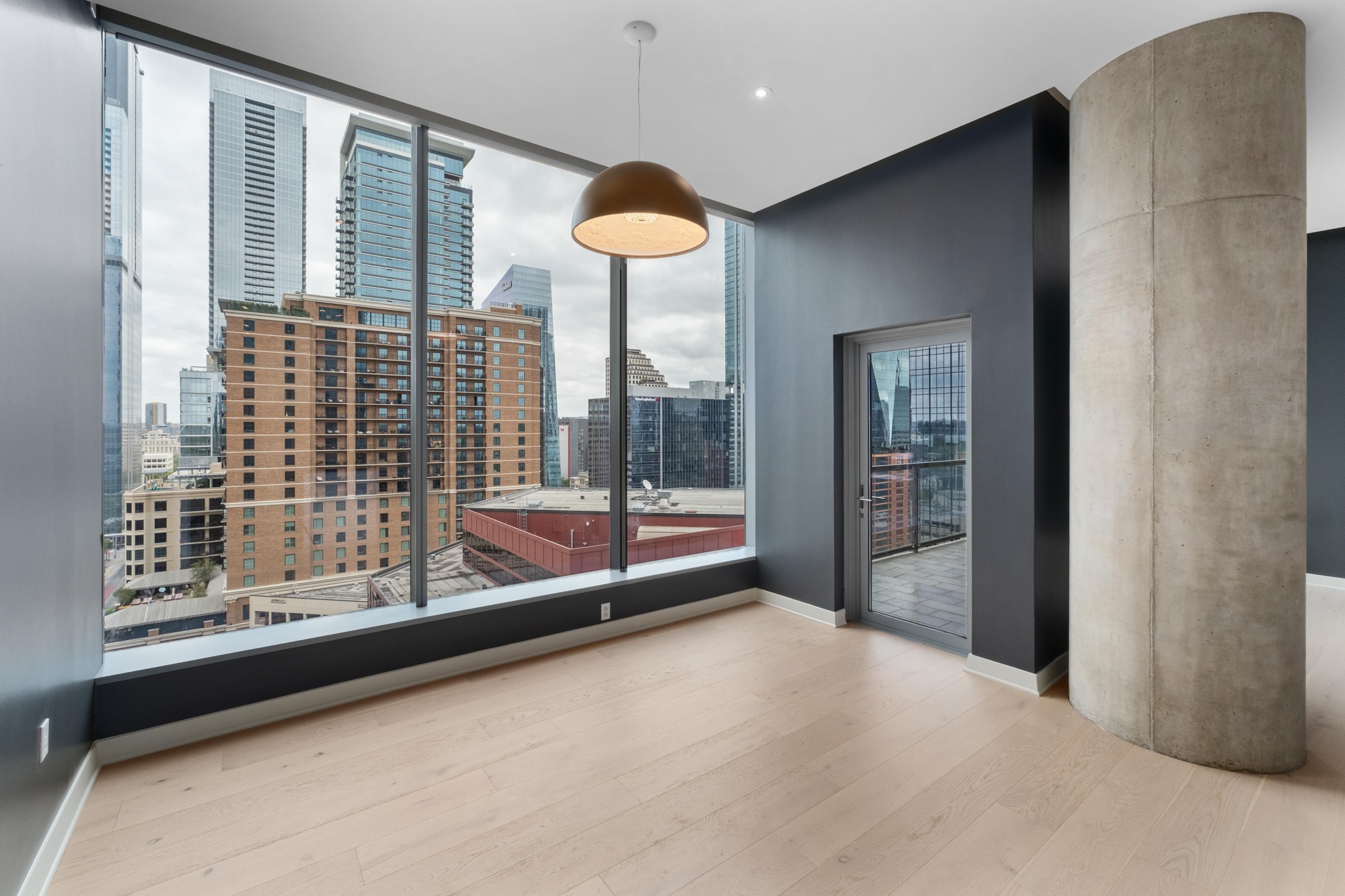 210 Lavaca Street, Unit 1810 Austin, TX 78701 - Photo 7 of 28 Unfurnished room featuring light wood finished floors and a view of city