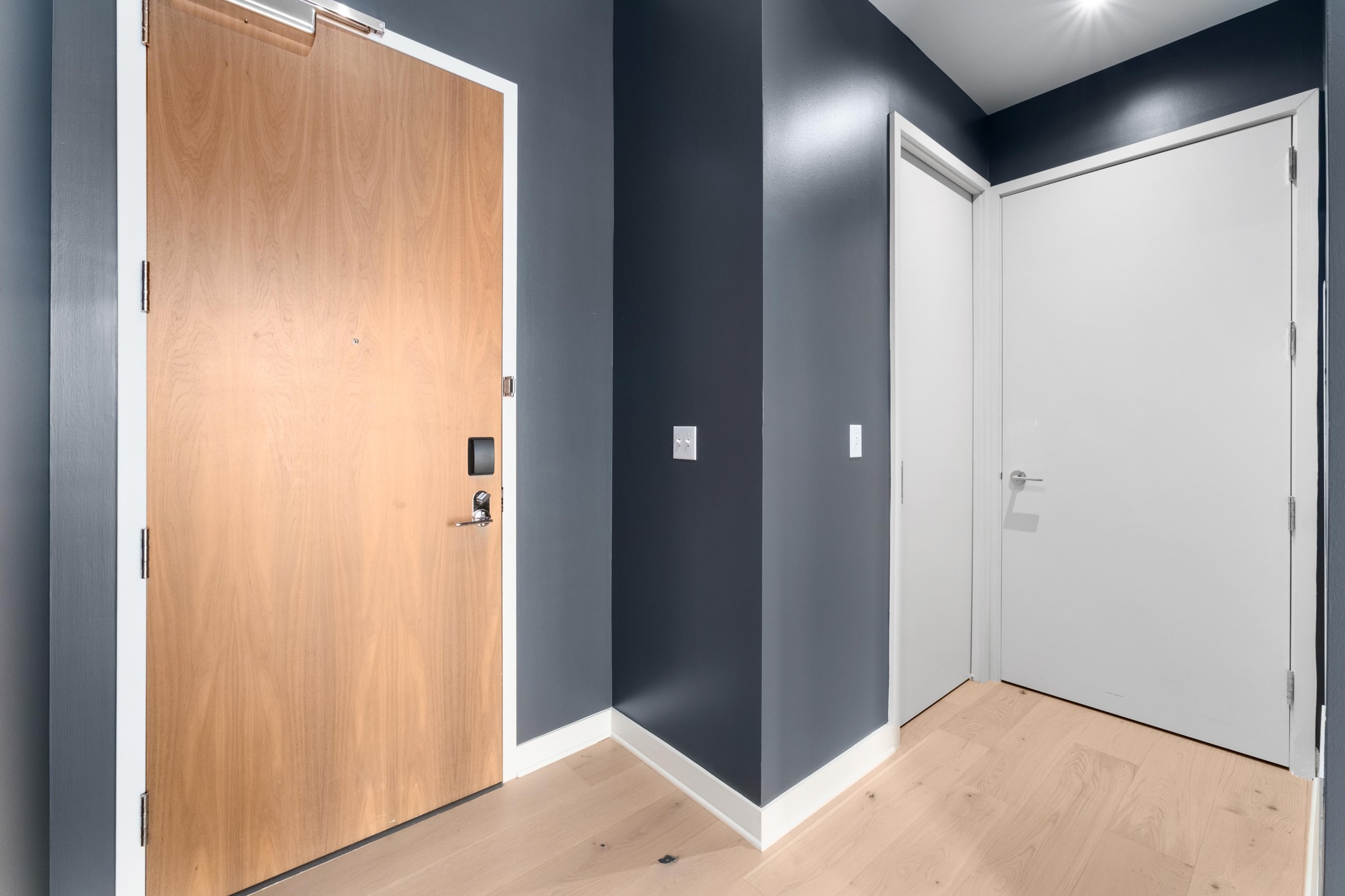 210 Lavaca Street, Unit 1810 Austin, TX 78701 - Photo 9 of 28 Entryway with light wood finished floors and baseboards