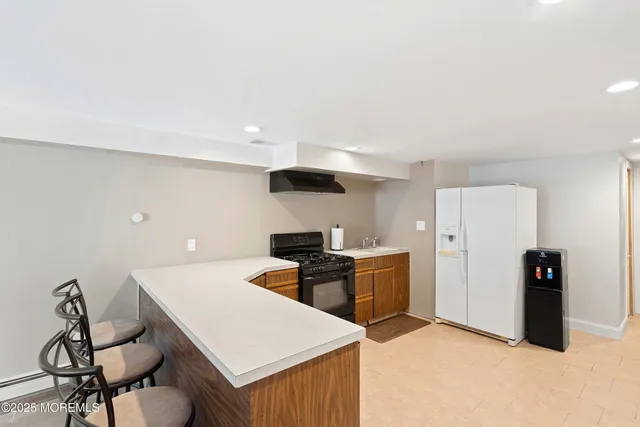 a kitchen with a table and chairs in it