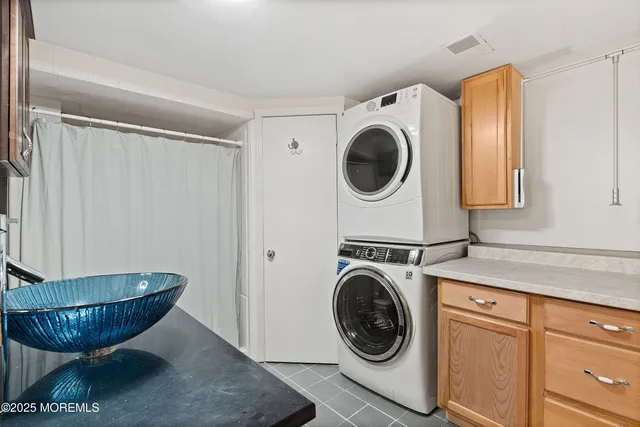 a view of a storage and utility room with washer and dryer