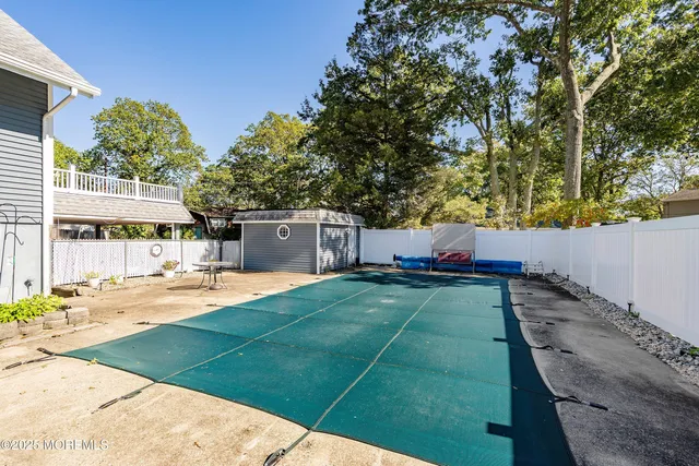 a view of a backyard with sitting area