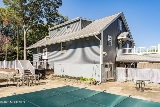 a view of the house with backyard
