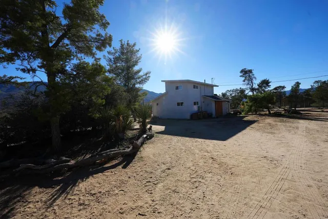 a view of a backyard of the house
