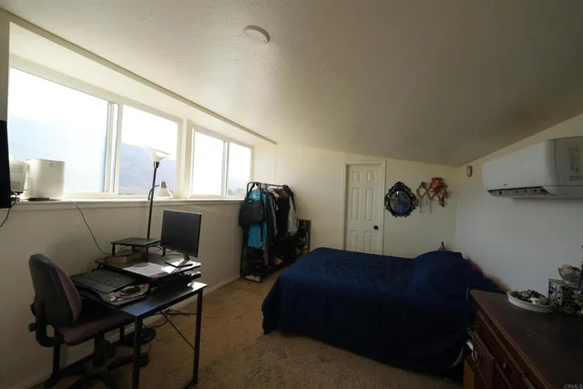 a workspace with furniture and window