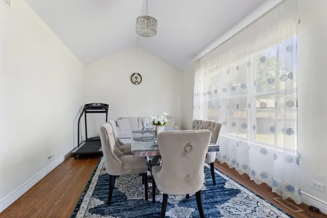 a view of a dining room with furniture wooden floor and a carpet