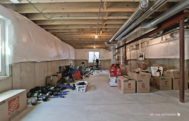 a view of a field with an trees in the background
