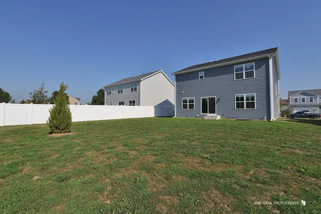 a house that has a window in front of a house