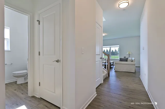 a bathroom with a sink mirror and toilet